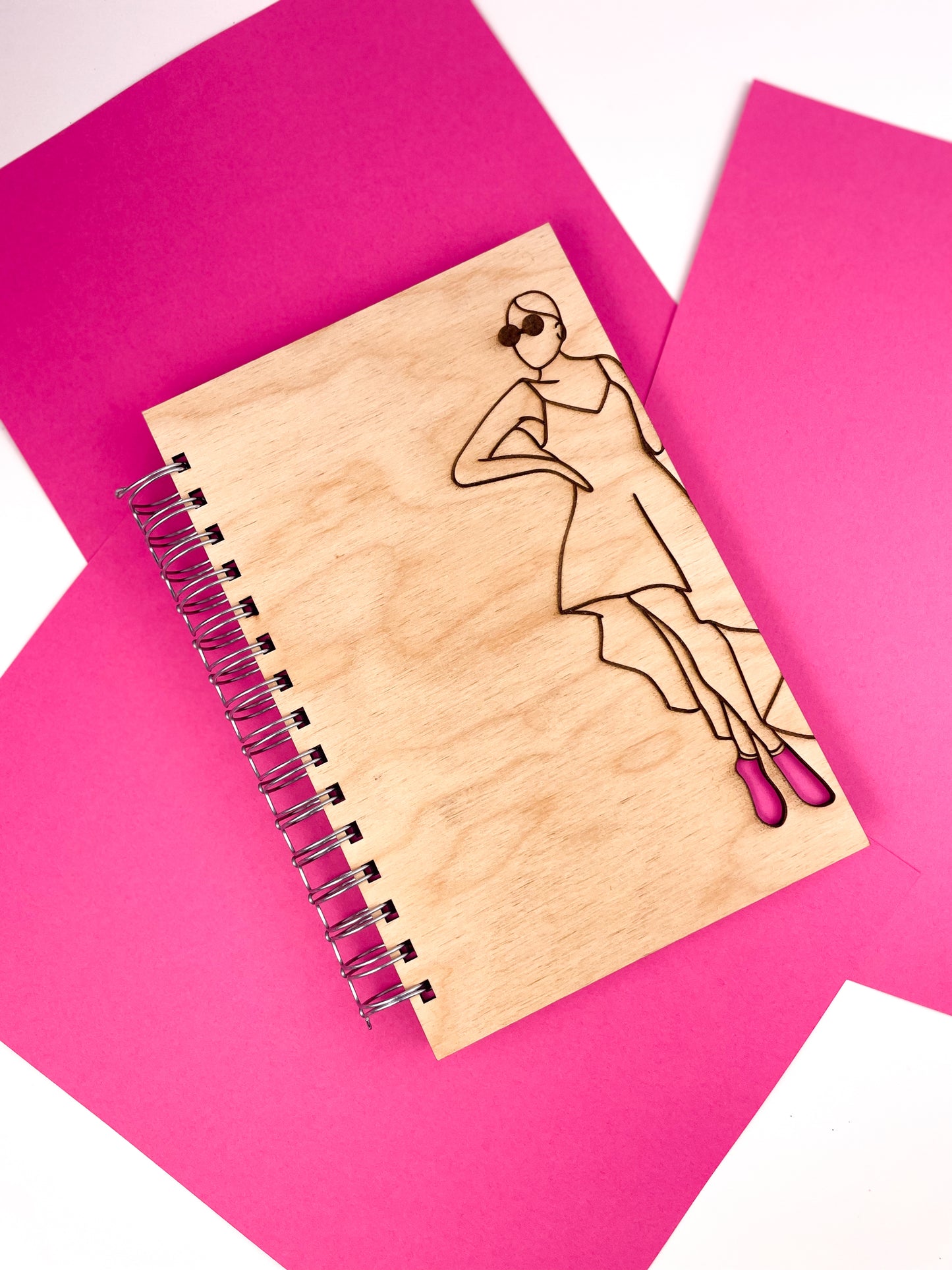 Glamorous woman wearing pink heels wooden journal
